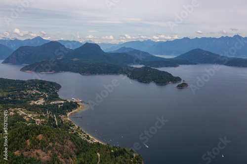 Gibsons, Sunshine Coast, British Columbia, Canada. Aerial View of a small town in Howe Sound during a cloudy summer evening.