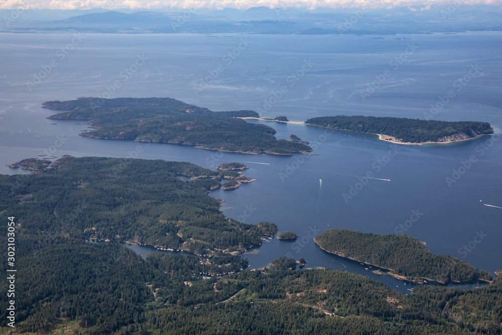Sunshine Coast, British Columbia, Canada. Aerial View of Thormanby Island, Smuggler Cove and Secret Cove during a sunny and hazy summer morning.