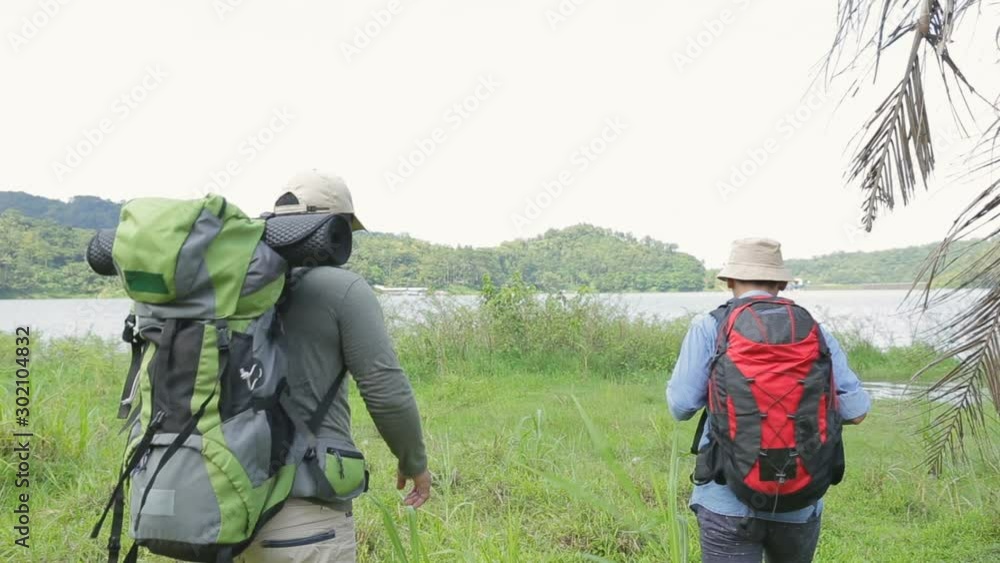 Two hikers out trekking in the wild Two hikers out trekking in the wild