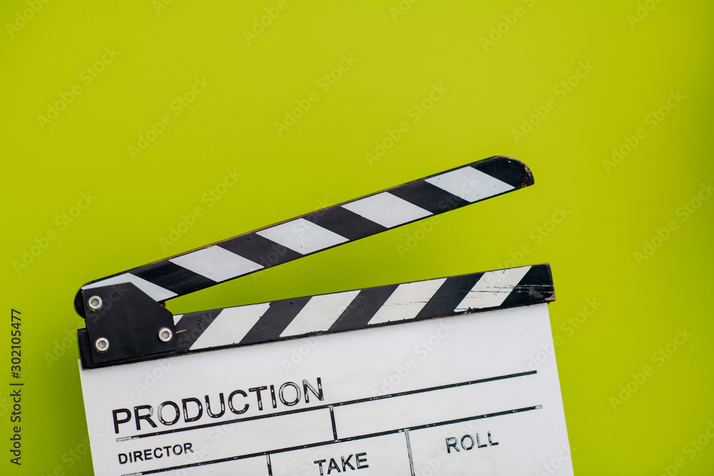 Obraz premium movie clapper on green background