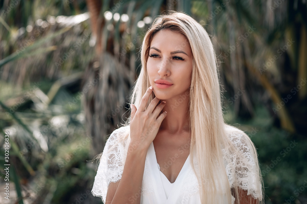 beautiful long haired blonde with big lips and brown eyes in white dress close up photo beautiful long haired blonde with big lips and brown eyes in white dress close up photo
