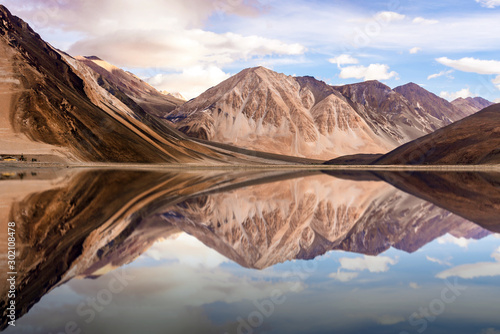 The reflection of mountain on the water.