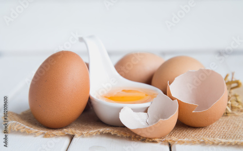 Eggs chicken on white wood background