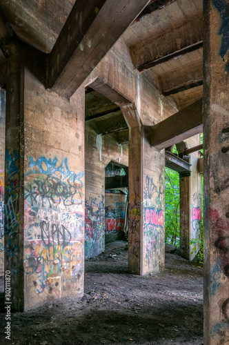 Graffiti covered old coal pier in Philadelphia, Pennsylvania called The Underground where young people go to play paintball. © Lori Labrecque