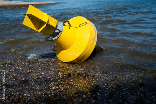 Warning buoy at the river. drought concept
