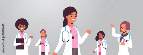 breast cancer day doctors wearing coats with pink ribbon mix race hospital colleagues team standing together disease awareness and prevention concept flat portrait horizontal vector illustration