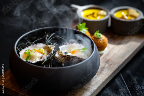 Photos Haute cuisine - noodles with oysters filled by freezy ozone , croutons and yello