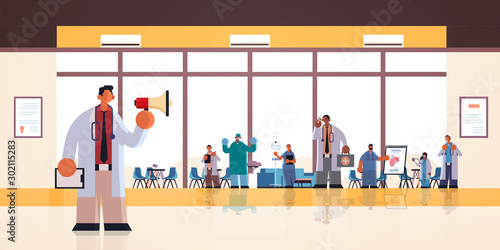 male doctor using loudspeaker making announcement for mix race hospital workers in uniform medicine healthcare concept modern clinic office interior full length flat horizontal vector illustration