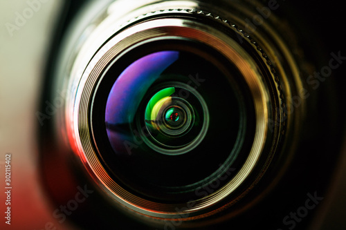 The camera lens with red and black backlight. Macro photography lenses. Horizontal photography © borislav15