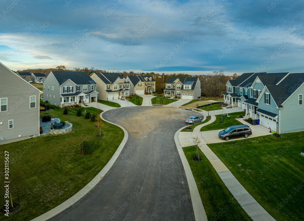 Aerial view of new construction street with luxury houses in cul-de-sac  upper middle class neighborhood American real estate development in the USA  with blue sky Stock Photo | Adobe Stock