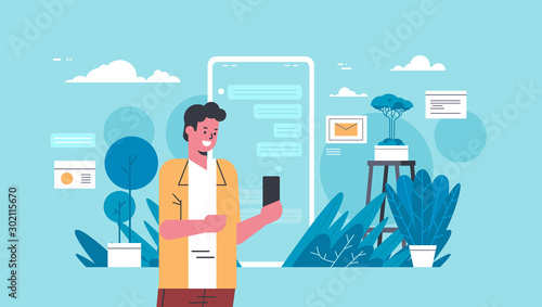 man holding smartphone casual guy using online mobile chat application social media network communication concept flat portrait horizontal vector illustration