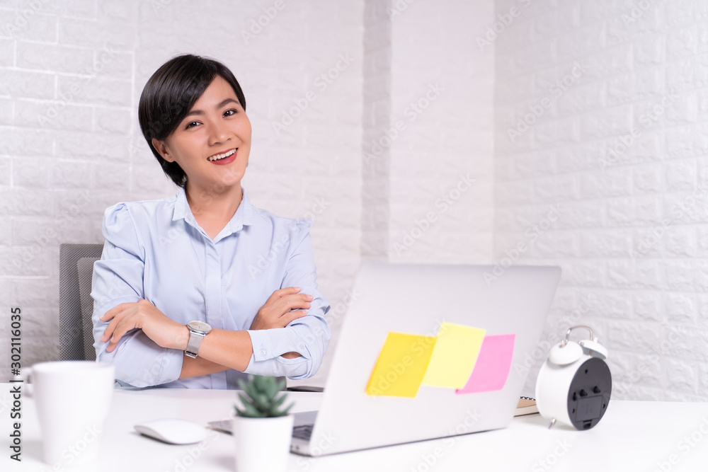 Happy woman sitting at home office working using computer laptop Happy woman sitting at home office working using computer laptop