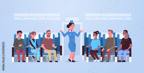 stewardess explaining instructions for mix race passengers flight attendant in uniform gesturing hands showing emergency exits safety demonstration concept airplane board interior horizontal vector