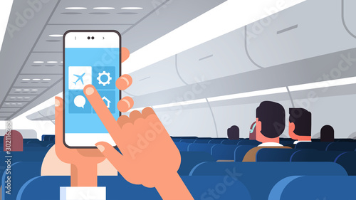 human hand holding smartphone with flight mode rules of airplane safety concept modern plane board with passengers horizontal flat vector illustration