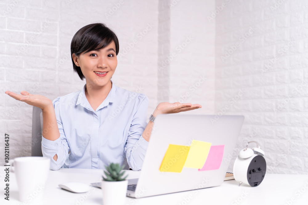 Portrait of a confused woman sitting at office Portrait of a confused woman sitting at office