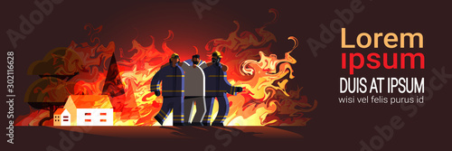 brave firemen couple rescuing injured man from burning house firefighters team in uniform firefighting emergency service extinguishing flame concept flat full length horizontal copy space vector