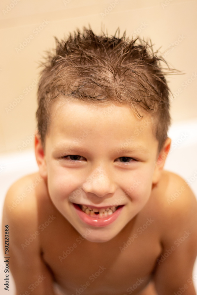 happy 6 year old boy in the bathroom. loss of children's teeth. happy 6 year old boy in the bathroom. loss of children's teeth.