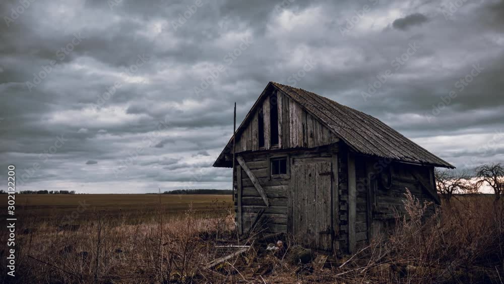 Old abandoned wooden barn in the fields and cloudy sky movement time lapse video. Old abandoned wooden barn in the fields and cloudy sky movement time lapse video.