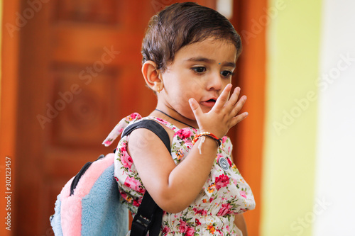 Tablou pe pânză Cute Indian girl child with school bag