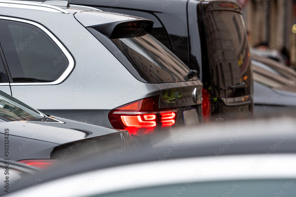 Obraz premium modern cars stands in traffic jam in rush hour