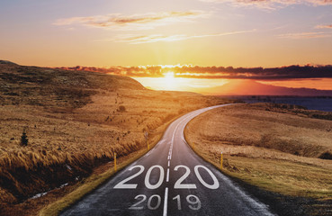 2020 and 2019 on the empty road at sunset. New Year concepts