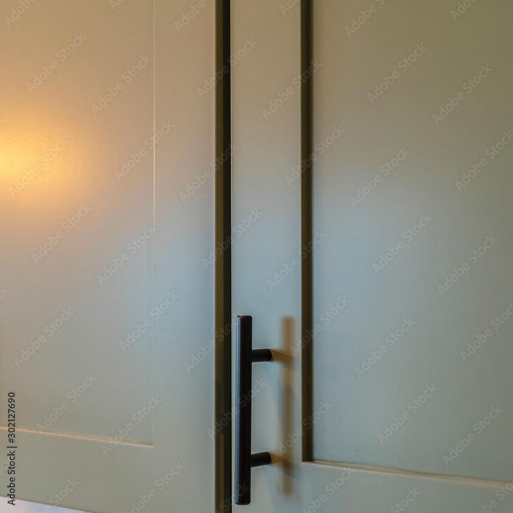 Square Close up of overhead kitchen cupboards at home Square Close up of overhead kitchen cupboards at home
