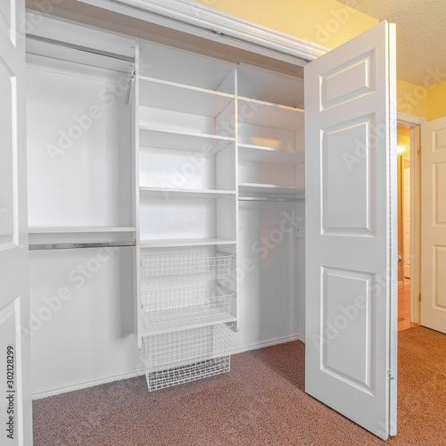 Square frame Empty white built in closet or wardrobe interior