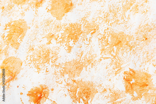 Abstract strokes of watercolor golden paint for background