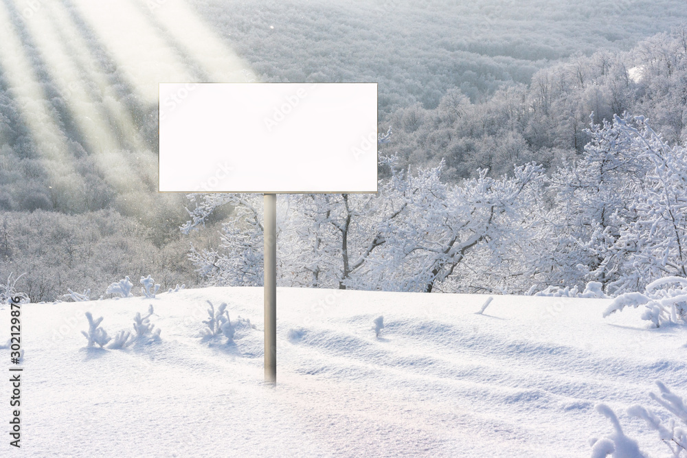 Winter snowy forest landscape. Single blank billboard. Winter Christmas New Year holiday concept Winter snowy forest landscape. Single blank billboard. Winter Christmas New Year holiday concept