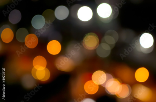Abstract multi color bokeh lights at night on background