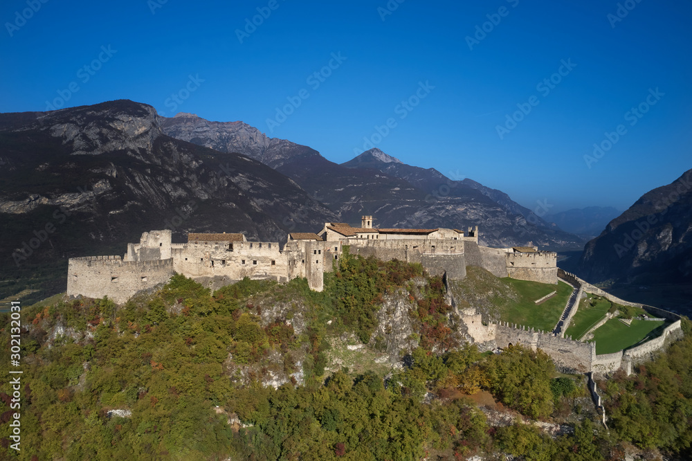 Fototapeta premium Aerial view of Castel Beseno, italy. Blue sky. Autumn season