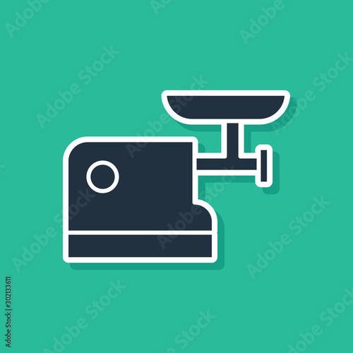 Blue Kitchen meat grinder icon isolated on green background. Vector Illustration