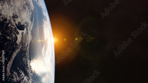Fototapeta Naklejka Na Ścianę i Meble -  View of planet Earth close up with atmosphere during a sunrise 3D rendering elements of this image furnished by NASA