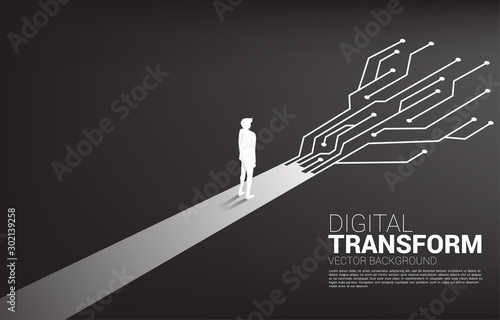 Silhouette of businessman standing on the way with dot connect line circuit. concept of digital transformation of business.