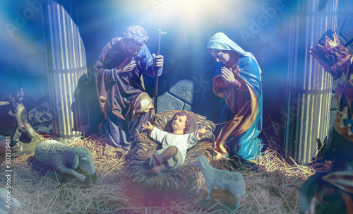 Traditional Christmas scenes and sacred light shining for use in illustration design Nativity scenes with Jesus baby on the manger with carvings, including Jesus, Mary, Joseph, sheep and magi