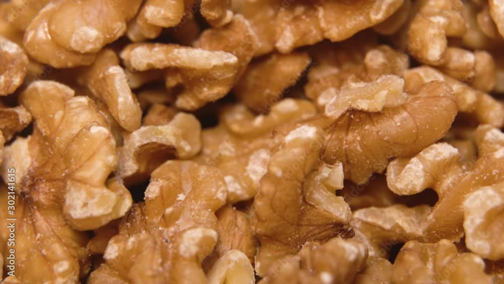 Walnut close up. product rich in minerals and vitamins. Walnut turns in a shot. Walnut kernels rotating. walnut close up Macro Walnut close up. product rich in minerals and vitamins. Walnut turns in a shot. Walnut kernels rotating. walnut close up Macro