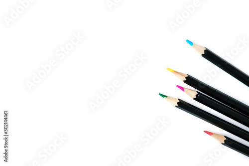 Colored pencils on white isolated background