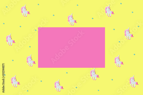 Blue stars and pink unicorns on yellow backdrop. © Татьяна Максимова