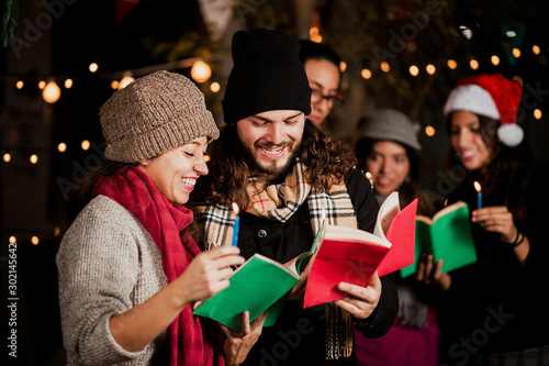 Obraz na plátně Mexican Posada, friends Singing carols in Christmas in Mexico