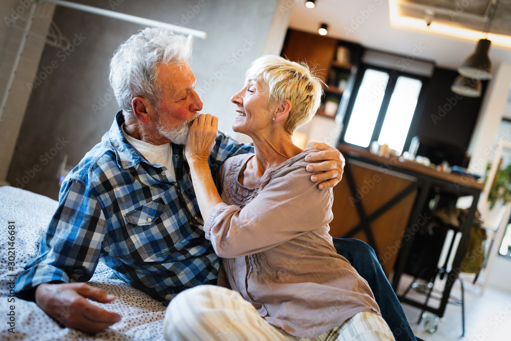 Cheerful senior couple enjoying life and spending time together Cheerful senior couple enjoying life and spending time together