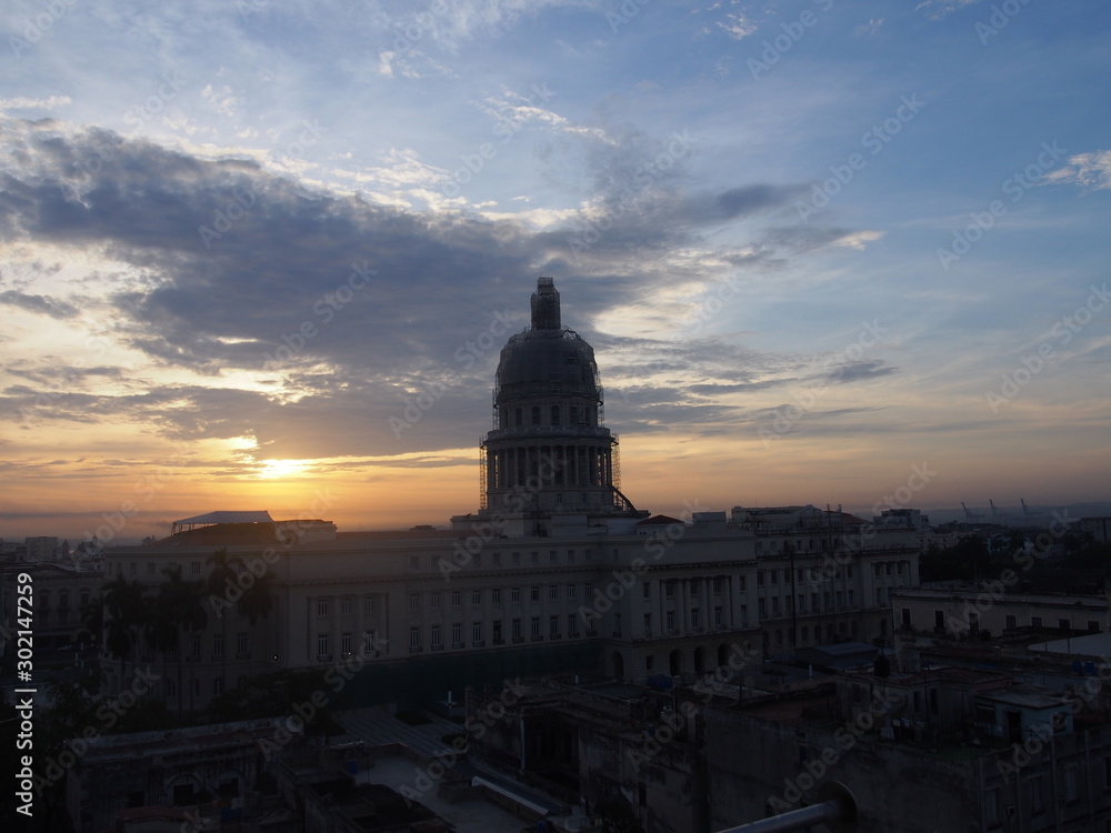 City view of historic buildings and streetscapes with a beautiful sunrise in the early morning, Havana, Cuba
