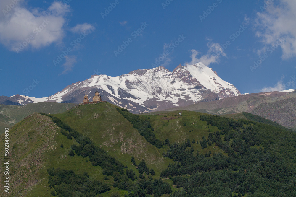 View of Gergeti Trinity Church in the Caucasus mountains. Georgia View of Gergeti Trinity Church in the Caucasus mountains. Georgia