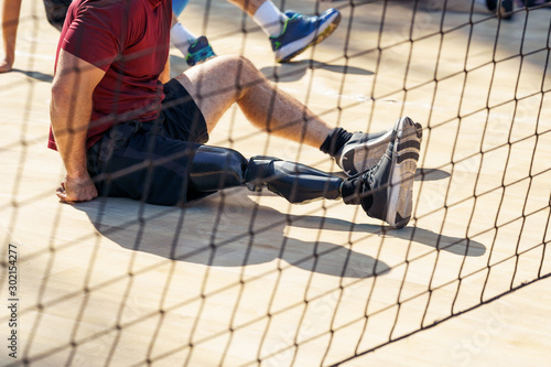 Parasporstman sitting during a volleyball match.Professional players . photo