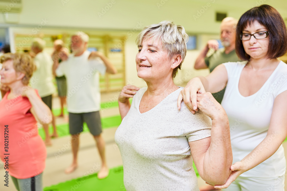 Physiotherapist gives help to senior woman Physiotherapist gives help to senior woman
