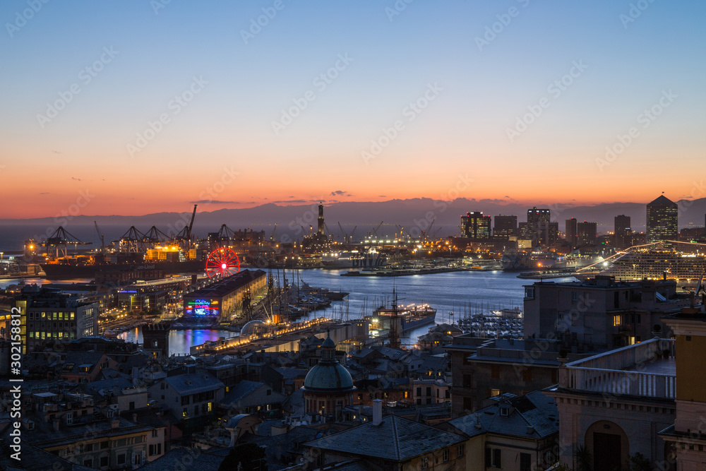 GENOA, ITALY, NOVEMBER  5, 2019 - Aerial view of Genoa, Italy at dusk, the harbor with the hiistoric centre, Italy, Europe