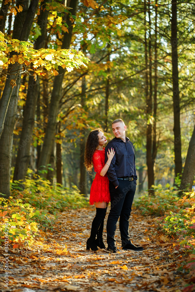 Fototapeta premium Beautiful couple in the autumn forest