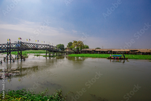 Saphan Khong Floating Market - SuphanBuri:10 November2019,River side attractions(giant fish randomly,bamboo bridge)There are tourists visiting to see the food,eat while onholiday,SongPhiNong,thailand