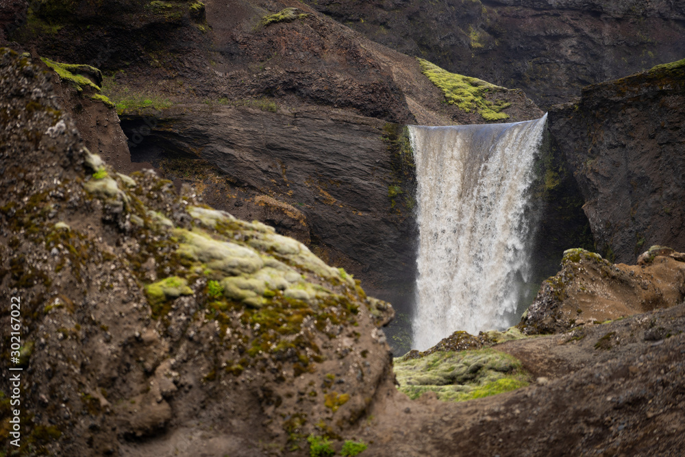 Obraz premium Beautiful smooth waterfall in Iceland during sunny day