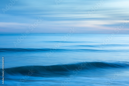 Abstract minimalist blue seascape at sunset taken at Brighton, East Sussex, UK.