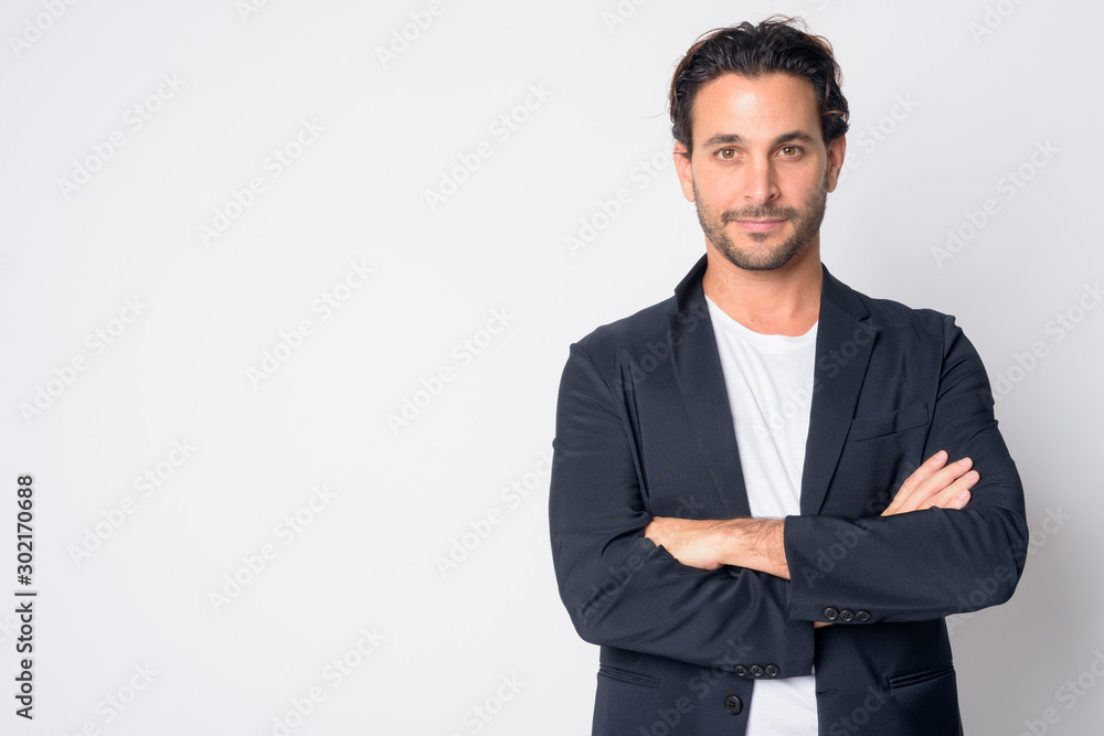Portrait of handsome Hispanic businessman with arms crossed - obrazy, fototapety, plakaty 